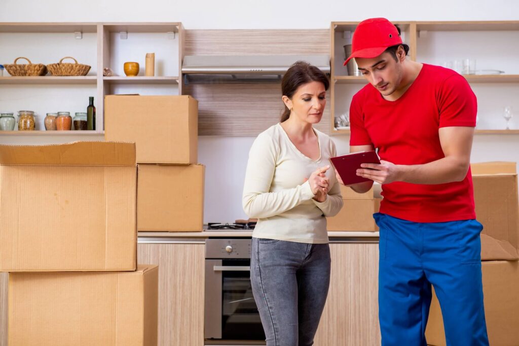 A woman moving overseas looking at her checklist together with an international mover