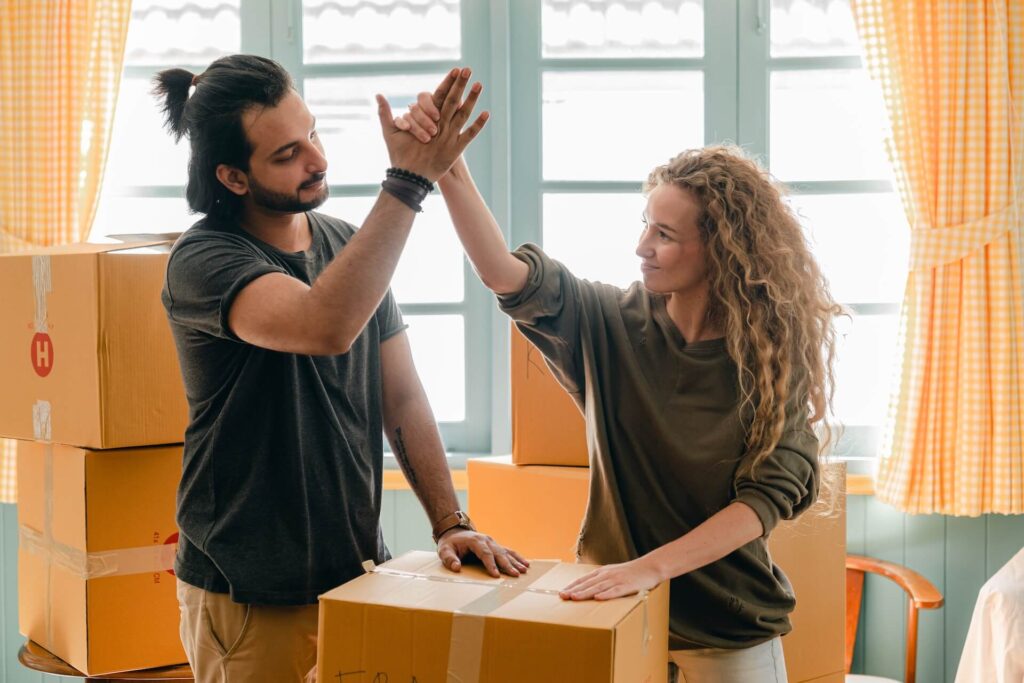 Couple finishing packing before moving internationally