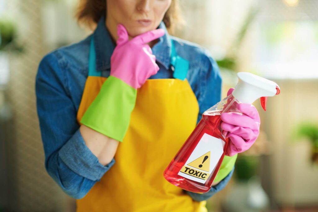 Woman looking at cleaning supplies