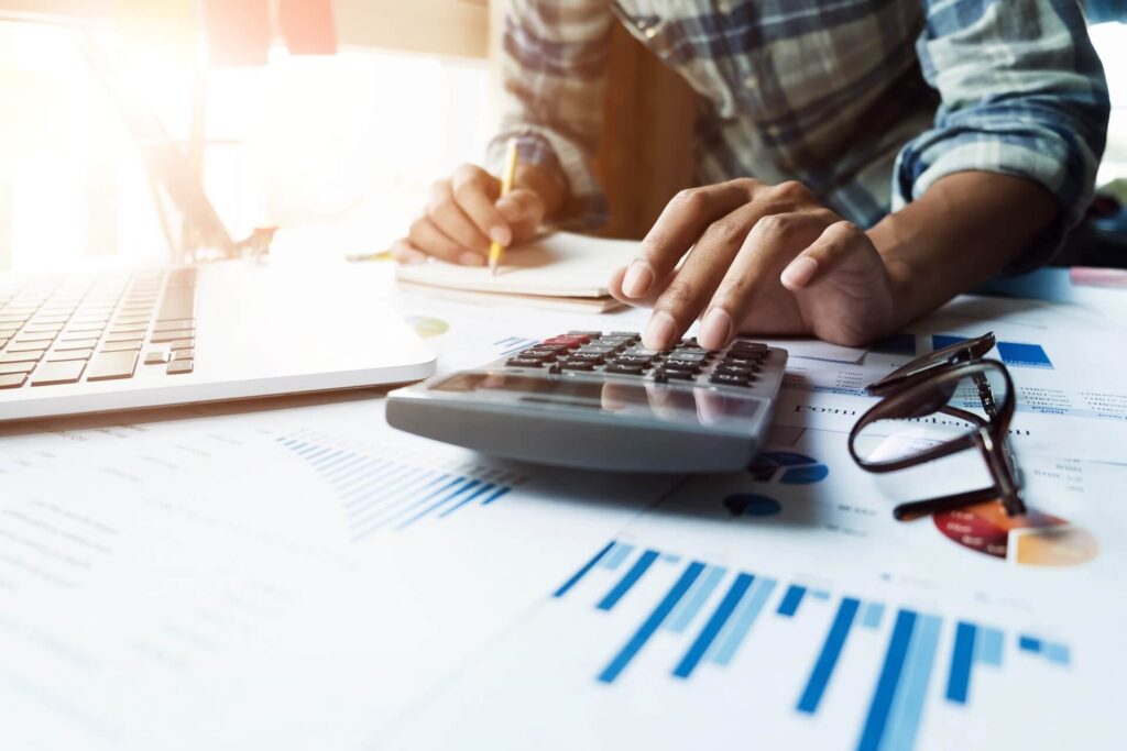 Man calculating expenses for an international move