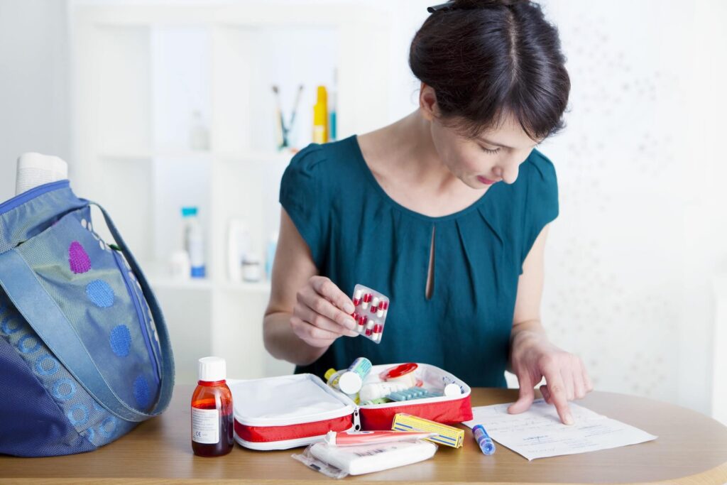 Woman preparing her medications before moving internationally