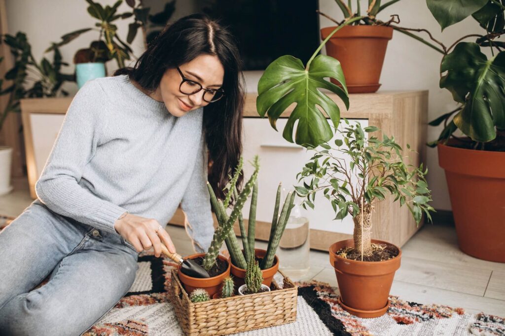 Woman taking care of her house plants