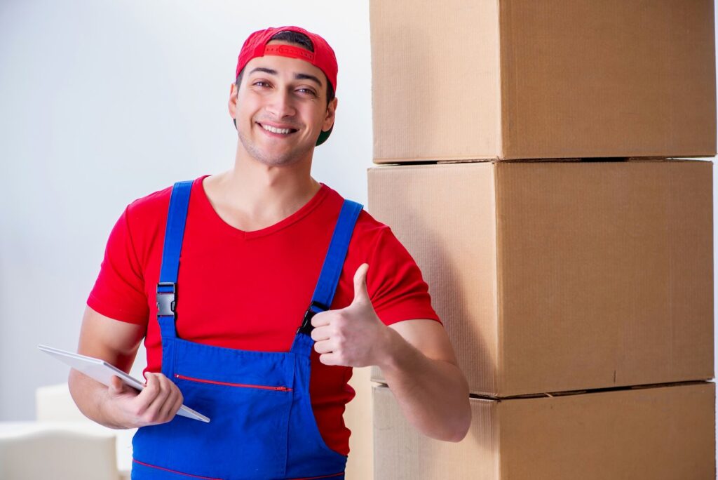 Professional mover with packed boxes for international moving