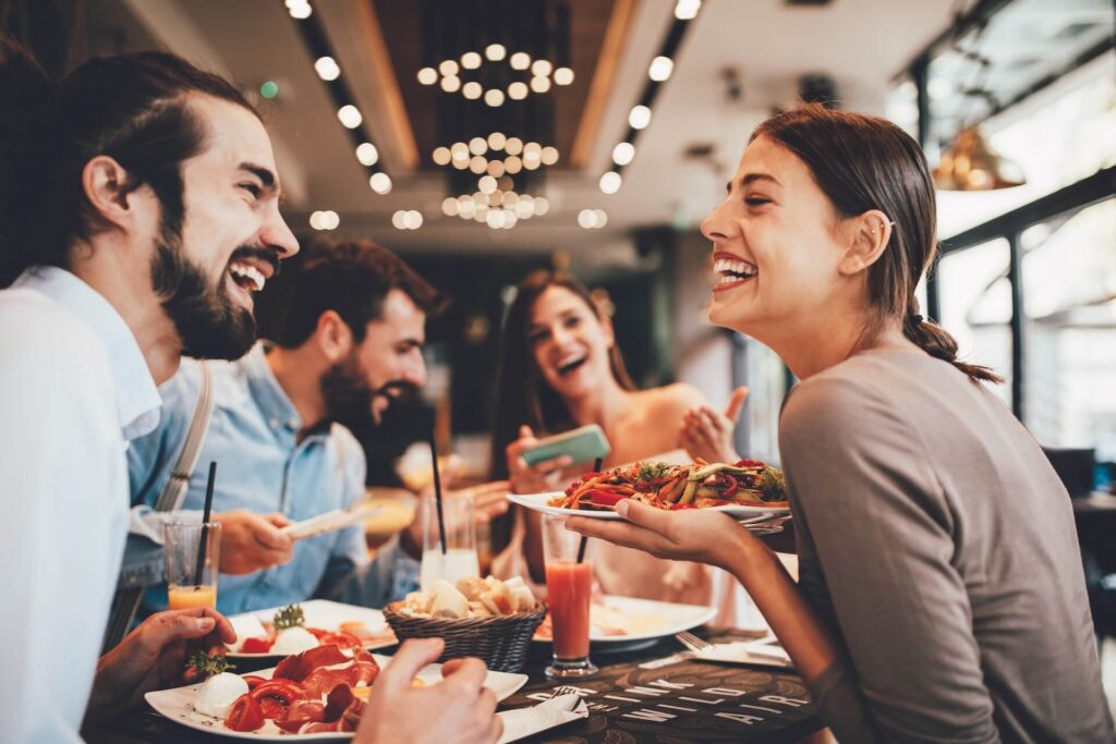 People laughing and eating