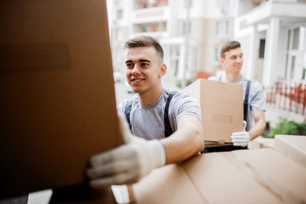 Professional international movers loading boxes