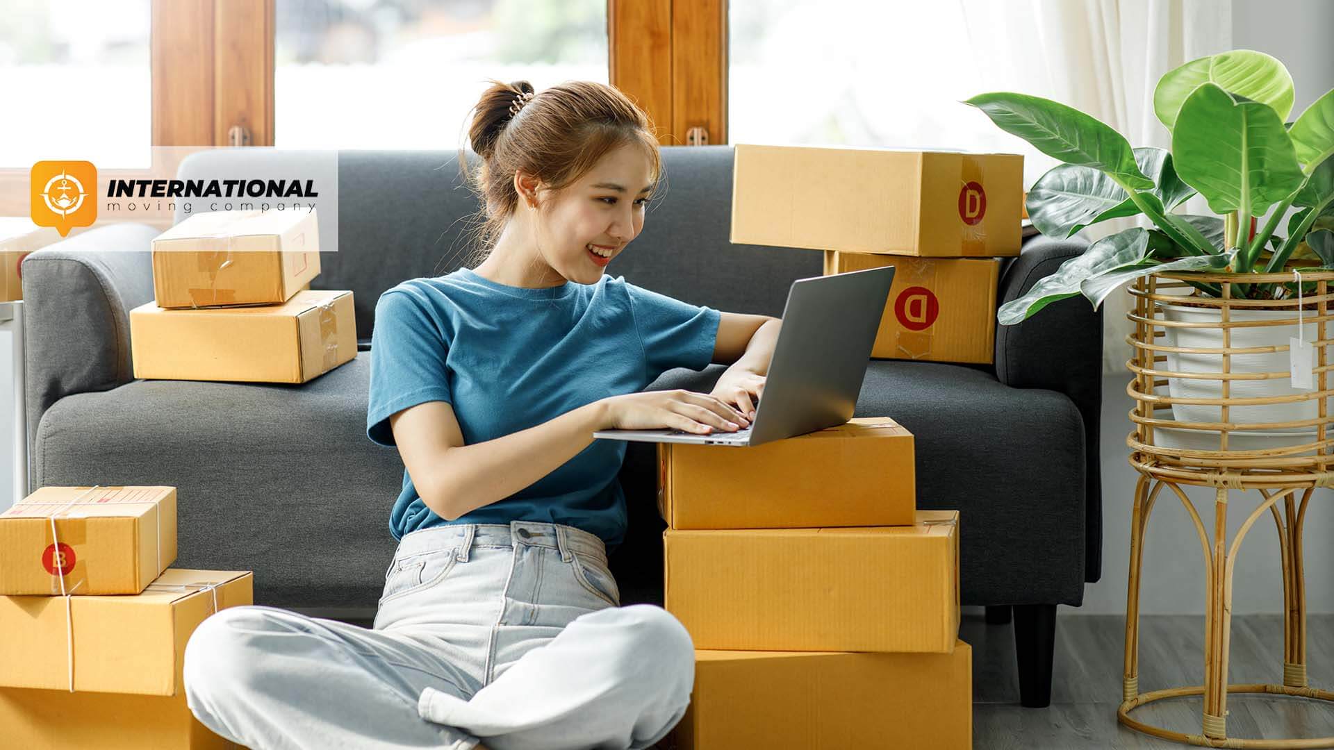 A girl searching for an international moving company on a laptop
