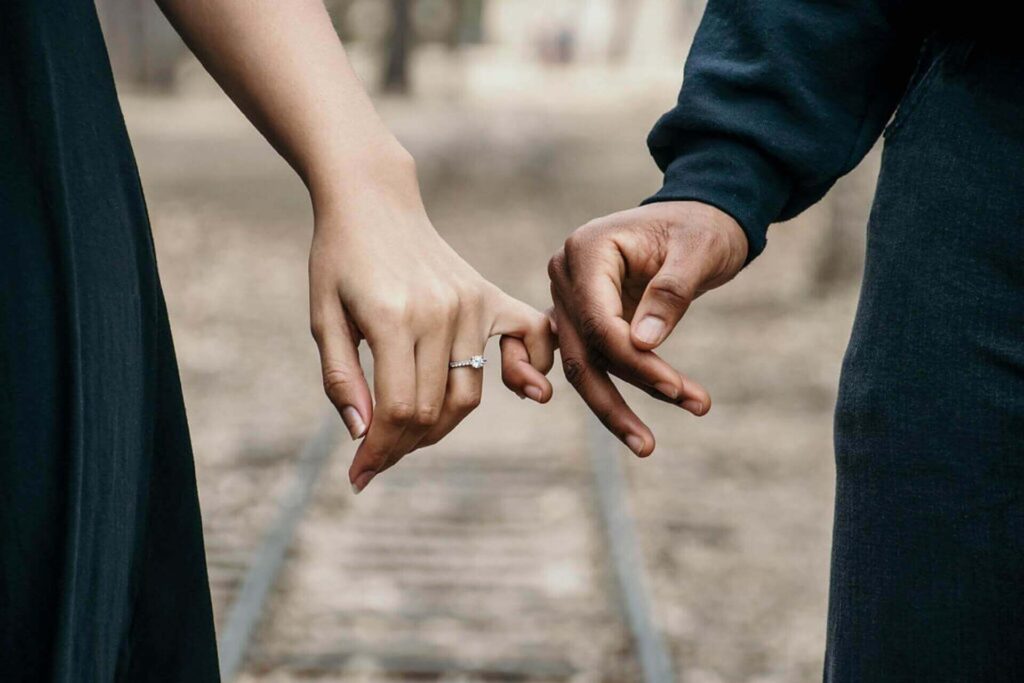 Couple holding hands after moving abroad