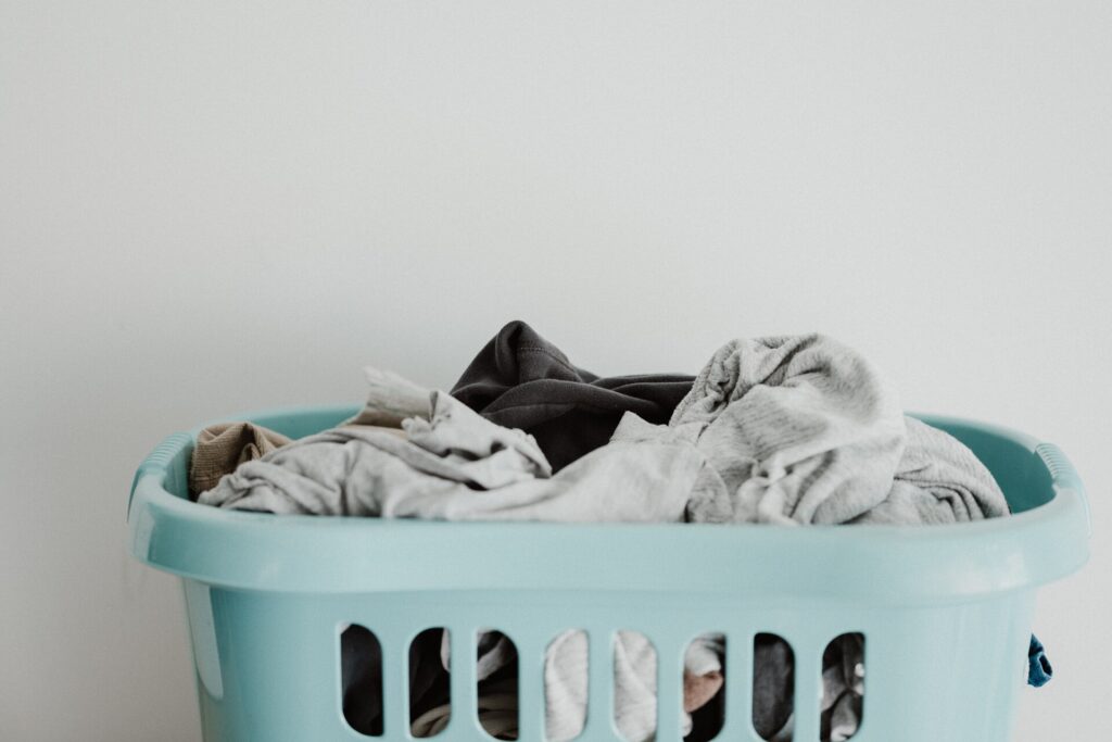 Blue laundry basket full of clean clothing