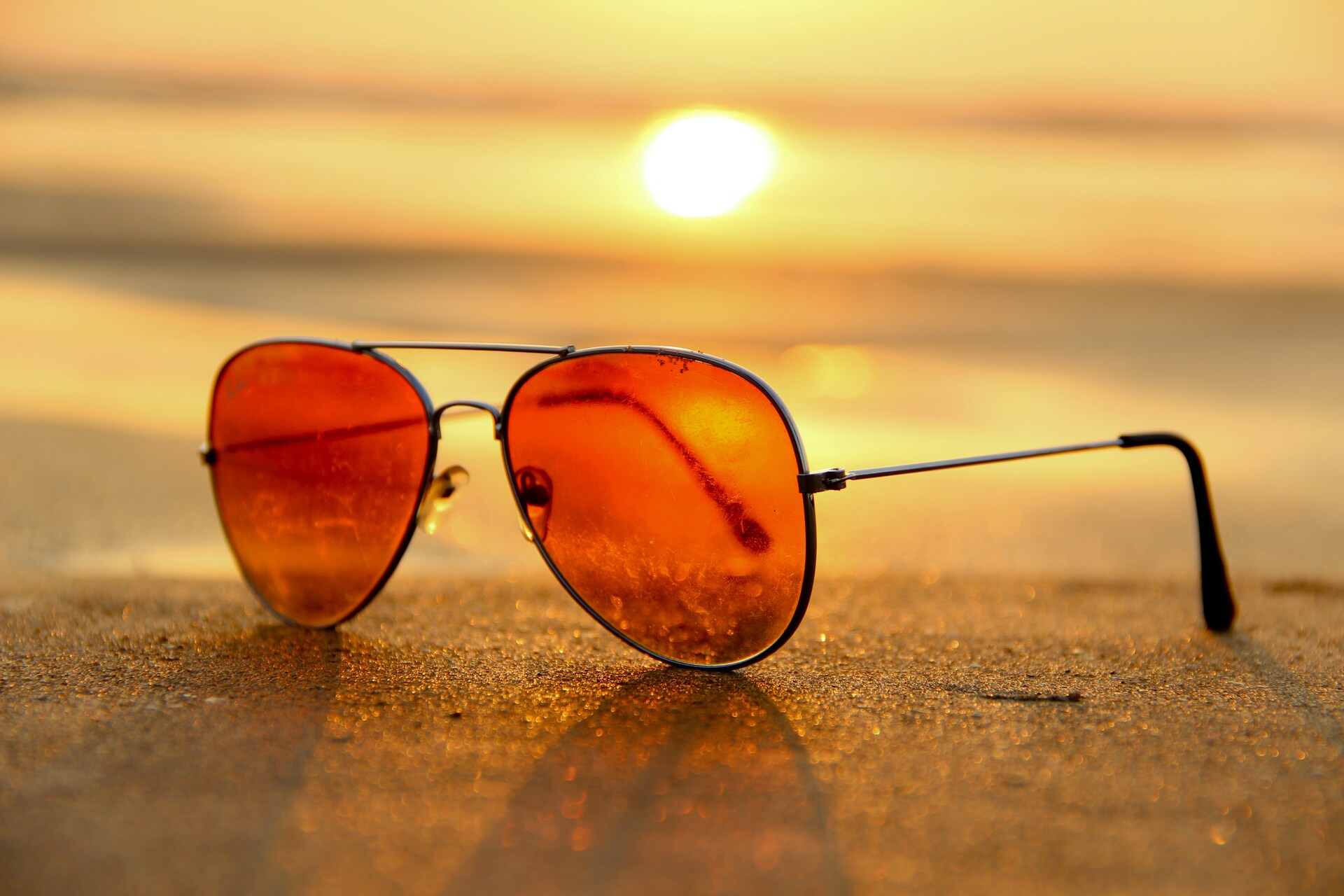 Sunglasses on sand