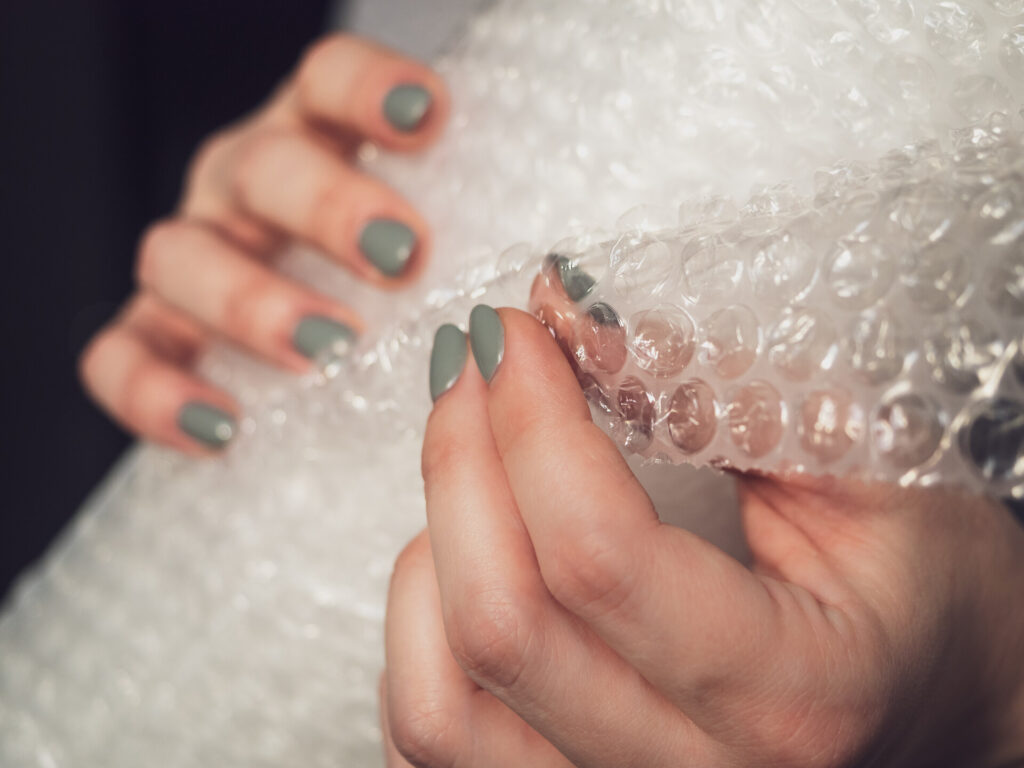 A woman holding a bubble wrap